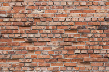 Fototapeta premium Wall of red bricks. Texture or background of bricks.