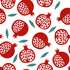 Seamless vector pattern with pomegranates and leaves on a white background. Natural seamless texture. A Scandinavian-style pattern. For wallpaper, textile, fabric, paper.