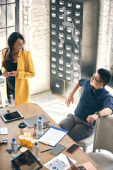 love affair at work. business couple. handsome man speak to cute woman in office. office life. boss...