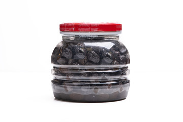 black olives in plastic jar isolated