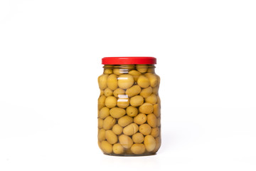 Big green olives in glass jar isolated