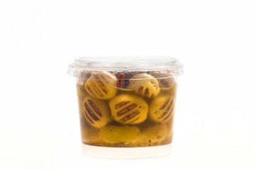 Green olives in small plastic jar isolated