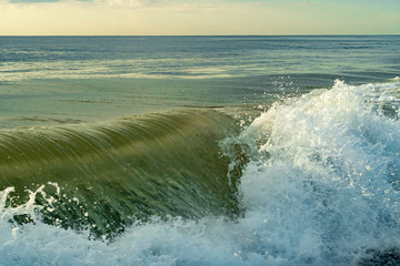 Morning sunrise and waves at the beach