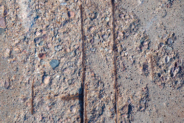 Reinforced cement slab close-up. Construction background of cement and metal. Grey-brown construction texture.