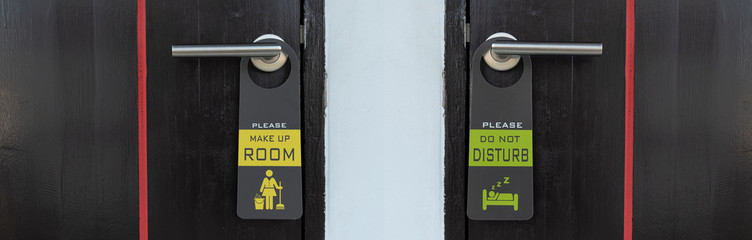 Close up of the sign -Please make up room and do not disturb on door handle