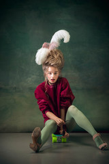 Skater girl. Young woman as Marie Antoinette isolated on dark green background. Retro style,...