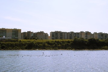 river view and multi-storey buildings