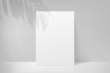 Mockup poster with shadow plant leaf from the window. Mock up sheet paper. White empty blank. Vector illustration