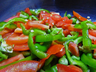 chopped raw carrot capsicum tomato green pee