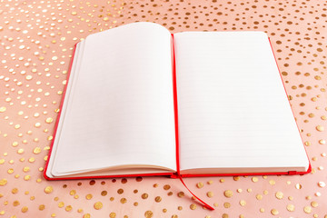Opened diary on polka beige pattern with copy space 