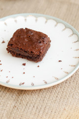 Fototapeta na wymiar brownie on a plate with crumbs