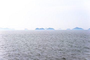 Misty island,mysterious seascape in light fog.