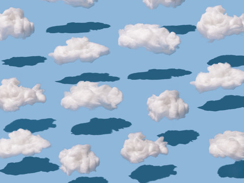 Pattern made of clouds of cotton wool on pastel blue background. Cyberpunk aesthetic concept art. Minimal surrealism.