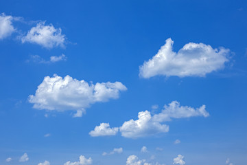 Obraz premium white fluffy clouds on blue clear sky, nice weather, panorama of beautiful clouds