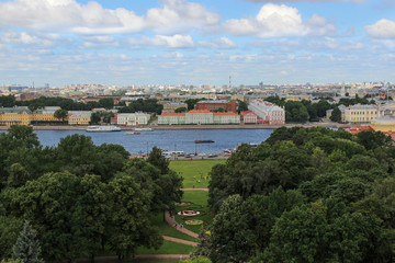 Fototapeta na wymiar Beautiful view of St. Petersburg. Neva embankment and old colored buildings.
