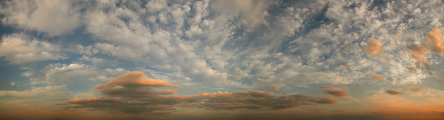 Golden twilight. Dramatic skies under evening sea