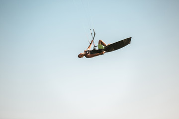 Kitesurfing Kiteboarding action photos man among waves quickly goes