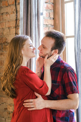 A young couple hugs tenderly and sensually on a date. How to find your partner and keep love