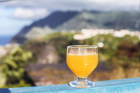 A glass of poncha in a cafe with a view, Porto da Cruz, Madeira, Portugal