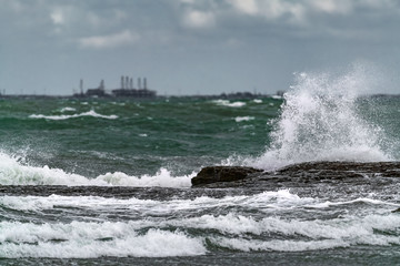 Big waves breaking coastal rocks