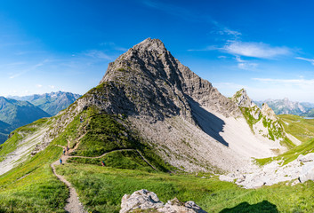 Fototapeta premium Climbing the Karhorn Via Ferrata near Warth Schrocken in the Lechquellen Mountains