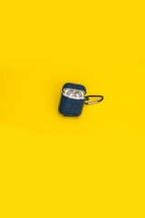Wireless Earphones on a Yellow background