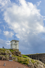 Fototapeta na wymiar Klokketårnet—The Bell Tower or Clock Tower building from 1833 at Fredriksten fortress in Halden, Norway.