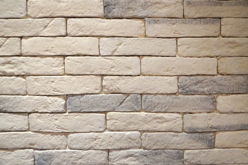 wall decorated with gray-white natural stone close up