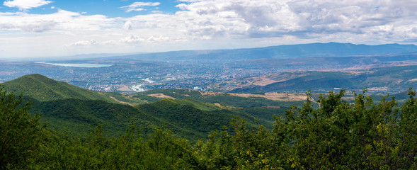 Naklejka na ściany i meble Beautiful view of the Tbilisi and old town of Mtskheta from the Zedazeni