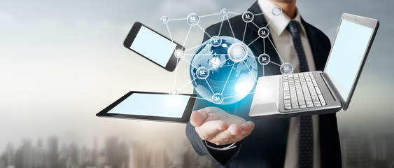 Technology tech devices connected to each other in hands