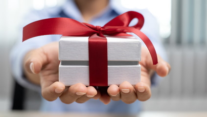 Asian women give a gift box on the big day, Christmas surprise.