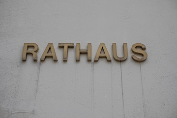 the town hall in Siegen with the lettering town hall and dirt flags