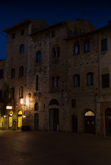 Fototapeta na wymiar Alley at night in the town of San Gimignano in Tuscany