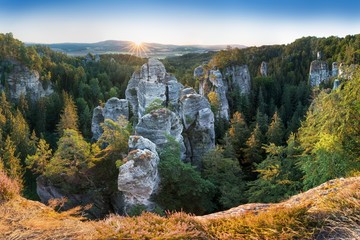 Sandstone rocks at the Europe landscape in summer season. Beautiful sunset, sandstone towers. Climbing on the sandstone rock. Bohemian Paradise (Cesky Raj). One of the most spectacular hiking regions. - obrazy, fototapety, plakaty