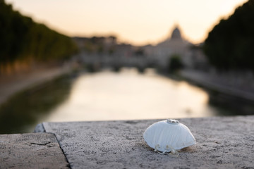 Respiratory protection mask lies on the concrete. Medical mask on the background of the city.