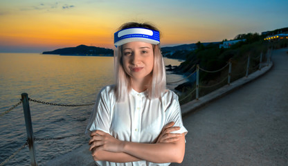 Fototapeta na wymiar Female in white blouse, transparent face shield, isolation mask on sea sunset background. Health protection and social distance concept. Summer time after quarantine