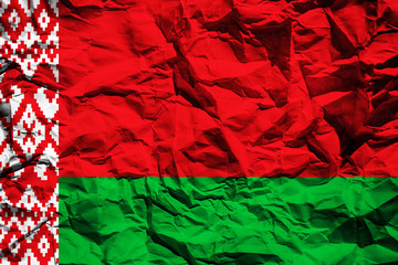 The national flag of Belarus on crumpled paper. Flag printed on a sheet. Flag image for design on flyers, advertising.