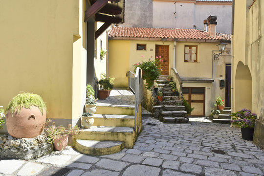 A narrow street among the old houses of Aieta, a rural village in the Calabria region.