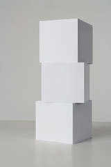 Three white boxes on a Gray background.

