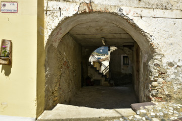 A narrow street among the old houses of Altomonte, a rural village in the Calabria region.