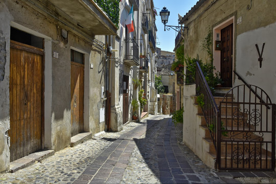 A narrow street among the old houses of Altomonte, a rural village in the Calabria region.