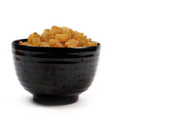 Bowl with dried golden raisins isolated on white. Dried Grapes.