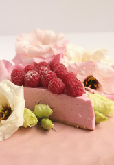 Raspberry cheesecake with berries and fresh flowers on pink plate food photo, sweet cake food photo art, kitchen, menu and restaurant photoshoot