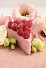 Raspberry cheesecake with berries and fresh flowers on pink plate food photo, sweet cake food photo art, kitchen, menu and restaurant photoshoot