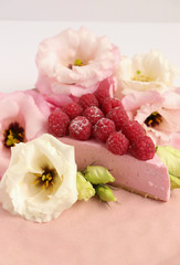 Raspberry cheesecake with berries and fresh flowers on pink plate food photo, sweet cake food photo art, kitchen, menu and restaurant photoshoot