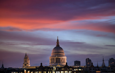 Fototapeta na wymiar A view across the River Thames at dusk towards St. Paul's Cathedral in London, UK.