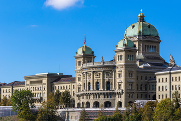Fototapeta na wymiar View of Federal Palace of Switzerland (Parliament Building) from south in old town of Swiss capital city Bern on sunny autumn day with blue sky and cloud, Switzerland