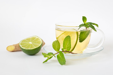 Green tea with lime, mint and ginger in a glass jar. Healthy lifestyle. Proper nutrition. Vitamins and antioxidants.