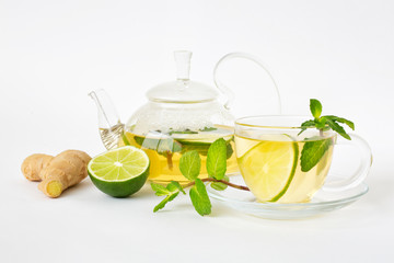 Green tea with lime, mint and ginger in a glass jar. Healthy lifestyle. Proper nutrition. Vitamins and antioxidants.