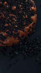 Blueberry pie with berries, homemade fresh pastries, on a stone background. Copy space.